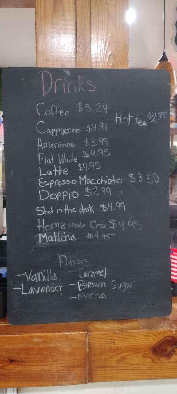 Pemberton Coffeehouse drinks chalkboard listing coffee, espresso, latte, matcha, chai and house flavors with prices
